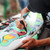A lifestyle image of Posca PC-8K Broad Tip Paint Markers in use on a surfboard.